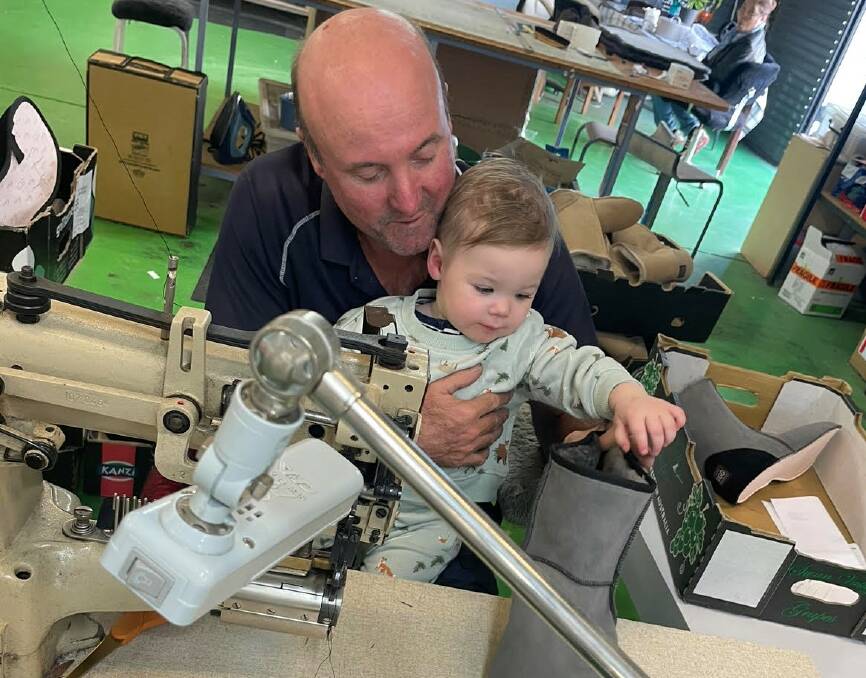 Michael Smith teaching his grandson Oliver about the Ugg boot making process.