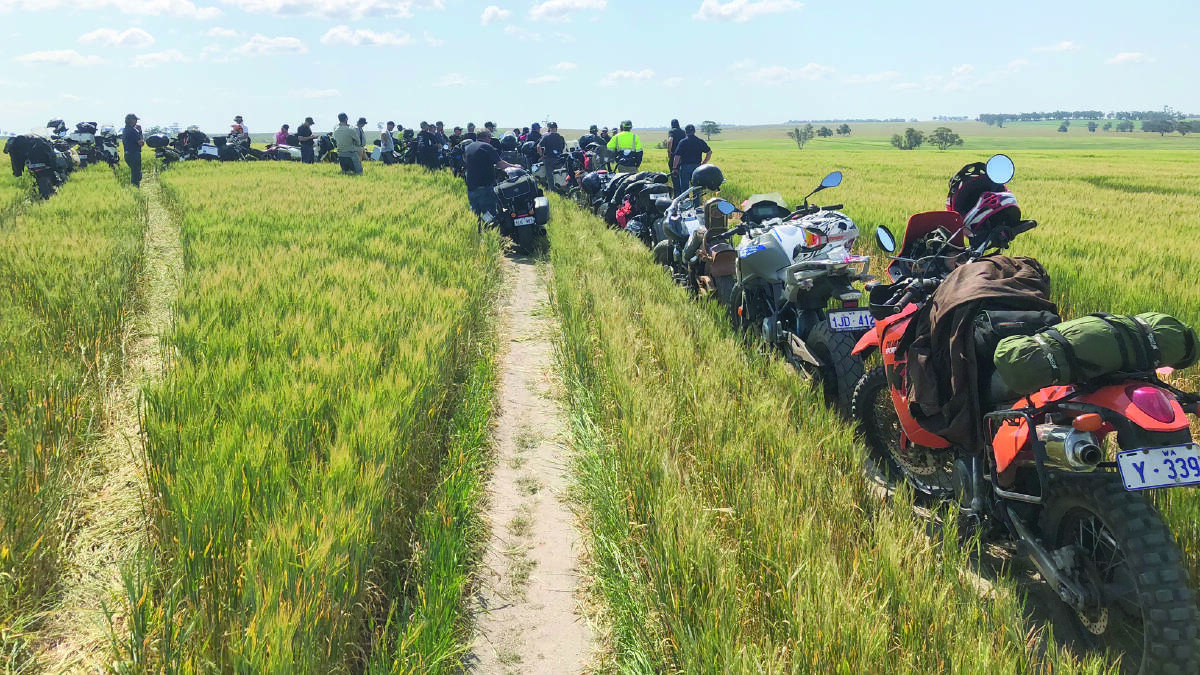 Riders on the Adama Two-Wheel Trial Tour arrive at the post-emergent grass and broadleaf herbicide mixtures site in barley, east of York.