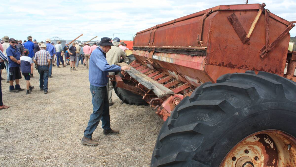 The old timers remember this Massey Ferguson 80 drill which came with a four-row float and full-cut tynes. It was snapped up for $150 as a mostly uninterested crowd moved on.