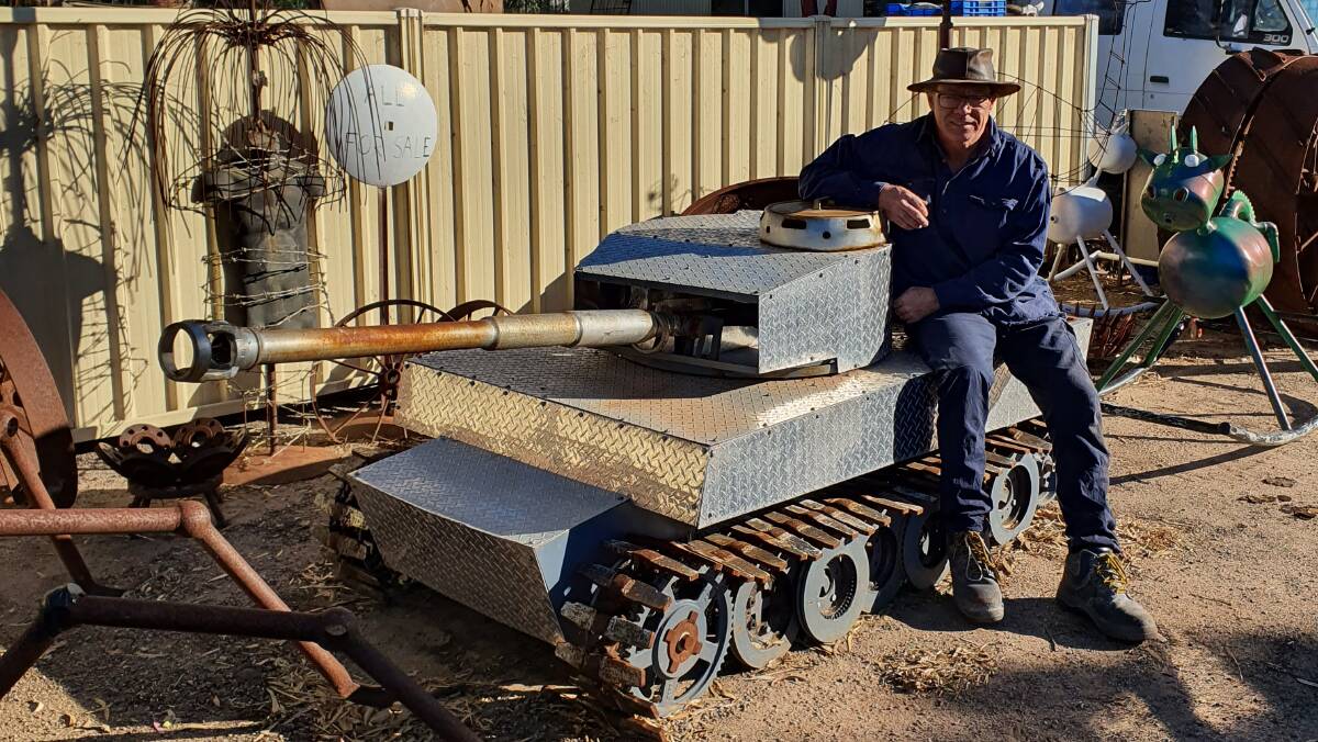 Peter James, Metal Art Creations, Dongara, with the one-third scale replica of a German Tiger tank he sculpted out of used pieces of machinery and scrap metal. He said the creation of the tank helped him work through a tough time, by inspiring and occupying him.