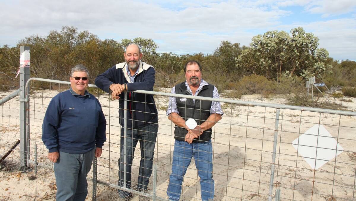 Geof Sanderson (left), Murray Ayres and Esperance Biosecurity Association and WA Stud Merino Breeders Association president Scott Pickering at Ravensthorpe for the opening of the Esperance extension of the State Barrier Fence.
