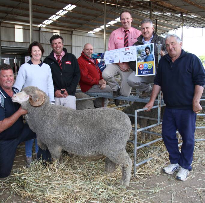 The $2000 proceeds from the sale of this Angenup ram was matched by Elders Limited with a total of $4000 donated to Lifeline at the Angenup ram sale this week. With the ram were Paul (left) and Tennille Norrish, Angenup stud, Kojonup, Elders Kojonup agent Jamie Hart, Elders State livestock manager Simon Wilkinson and Elders Kojonup branch manager Cameron Grace, ram buyer sponsor Tony Murdoch, Virbac southern WA representative and buyer Rob Leusciatti, M & L Leusciatti, Kojonup.