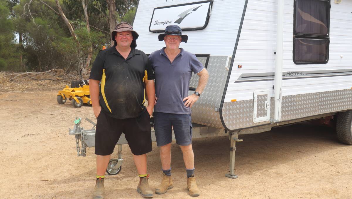Jason Bridges (left), Perth and Kim Hayes, Esperance, next to the 2009-built caravan that sold for $36,000. Kim (right) volunteered his time over the three months it took to prepare for the clearing sale, helping out with lots and heavy lifting, sometimes working 12 hour days. The Bridges greatly appreciated his help and support.