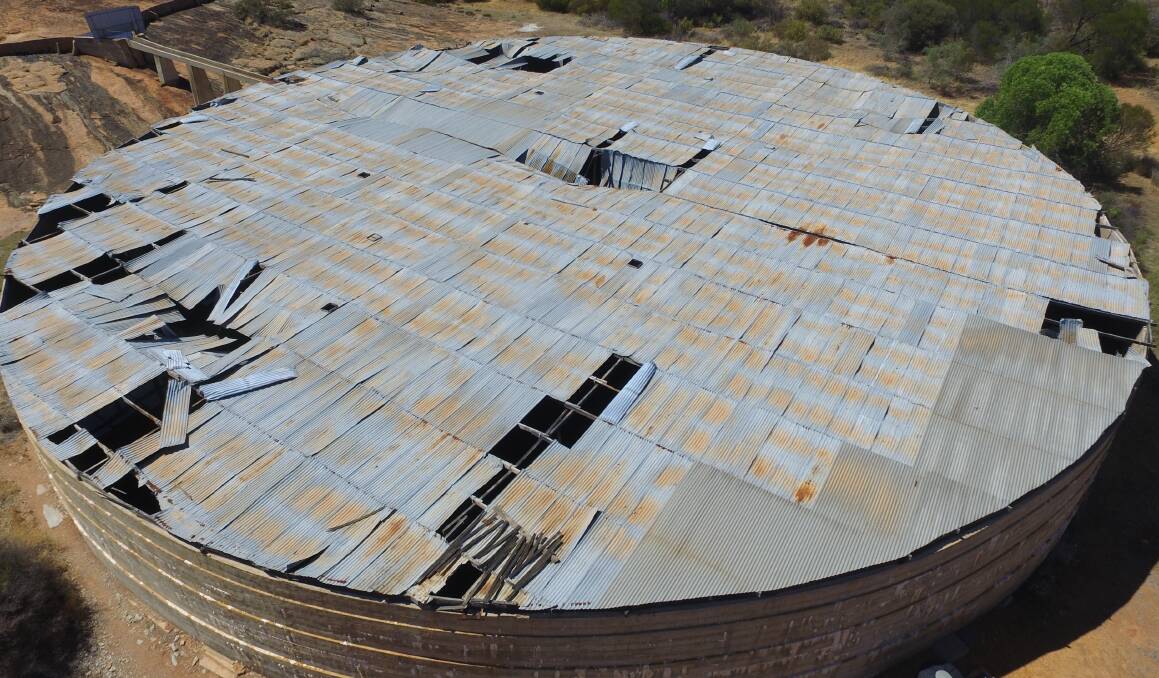 Beringbooding water tank near Bonnie Rock in the Central Wheatbelt, the largest rock catchment tank in Australia, is being emptied into adjacent bushland so the Water Corporation can remove the roof. The timber frame inside the concrete tank supporting the iron roof sheets is collapsing, with a risk of loose sheets being blown off the roof. Photo supplied by Romina Nicoletti.
