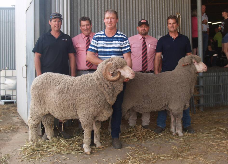 Derek Hooper (left), Wanjalonar Merino and Poll Merino stud, Narembeen, took home two rams from last week's East Mundalla on-property sale at Tarin Rock. With Mr Hooper and the rams he purchased were Elders stud stock manager Tim Spicer, East Mundalla co-principal Daniel Gooding, Elders Lake Grace representative Simon Sangalli and East Mundalla co-principal Ross Robinson. Mr Hooper purchased the Merino ram for $4400, the top Merino price and Poll ram at $11,000 which was the sale's third top price overall.