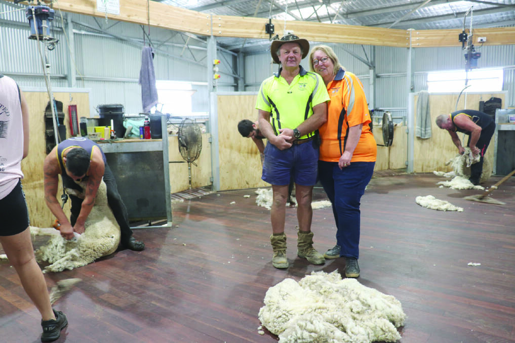 Geoff and Linda Bilney, Glenpadden Farms, Kojonup, on the boards of their innovative shearing shed. They finally held an open day in March, attended by 300 people, after having to cancel it twice because of COVID.
