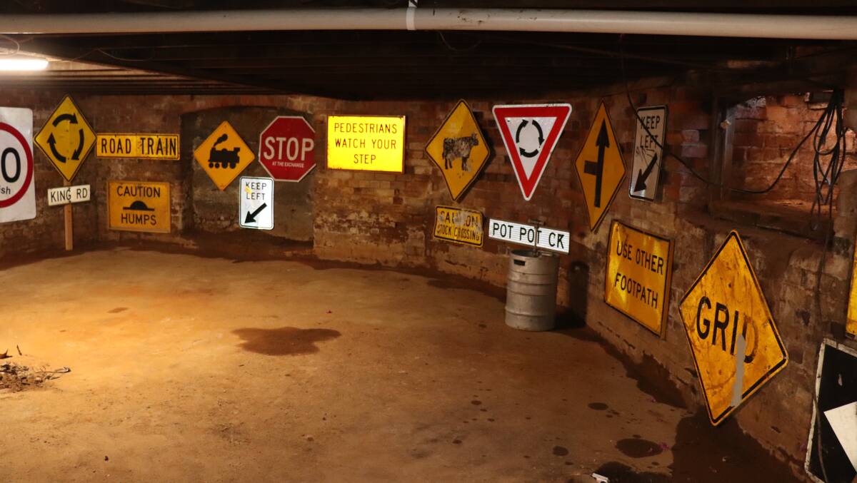 A collection of road signs Mr Duffy has gathered along his journey are on display underneath the tavern.