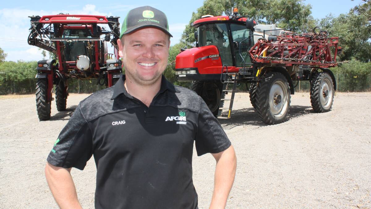 AFGRI Equipment salesman Craig Harris is ready to do business with these two self-propelled boomsprayers. See more of the company's specials in classified pages 124 to 129.