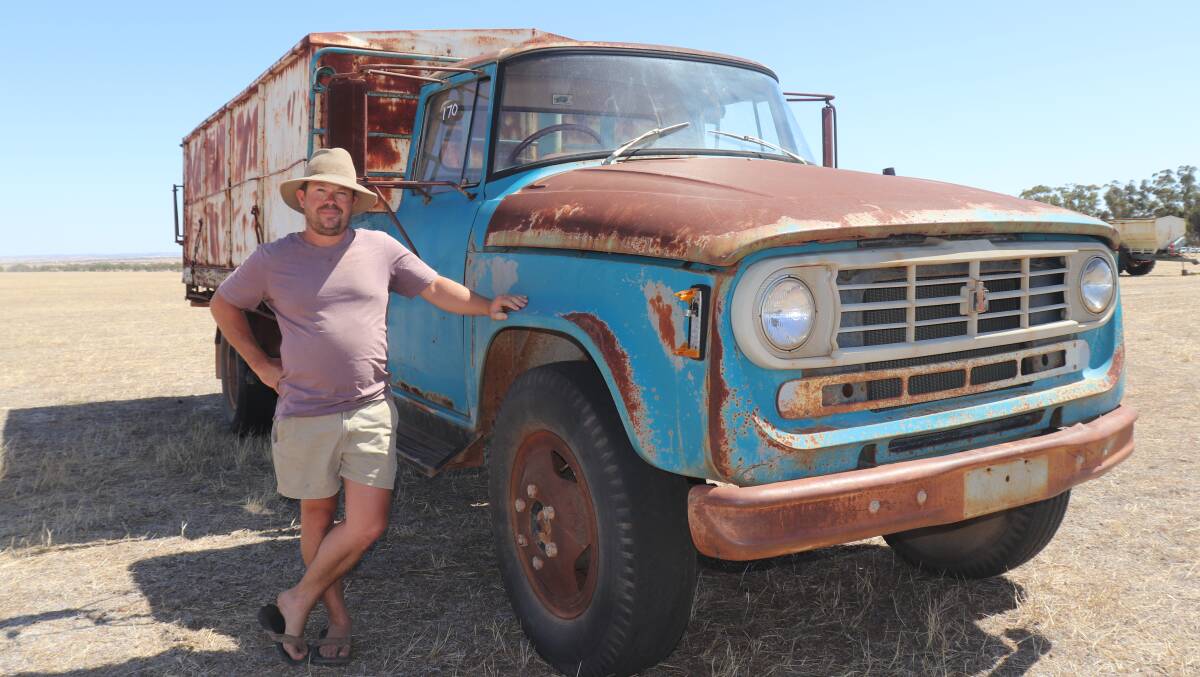 David Smoker, Narembeen, looked over the 1975 D1710 International tip truck with 345 petrol V8 engine and grain bin on the back. It later sold for $2200.