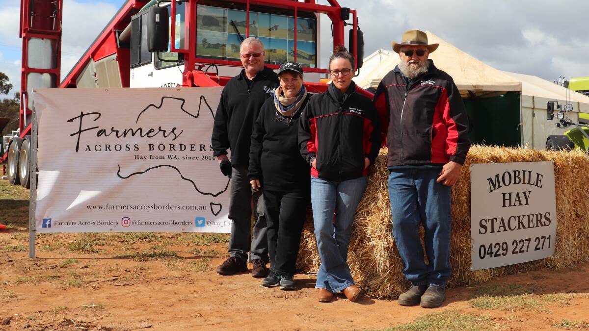 Farmers Across Borders representatives Graeme (left) and Jenny Perks from Grass Patch Farming, Esperance, were at the Newdegate Machinery Field Days two weeks ago sharing a site with Jules Laird and Roley Pearce from Mobile Hay Stackers, Beverley.