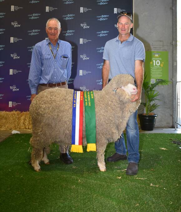  With the reserve grand champion August shorn Merino ewe and champion August shorn fine wool Merino ewe exhibited by the Tilba Tilba stud, Williams, were stud principals Stuart (left) and Andrew Rintoul.