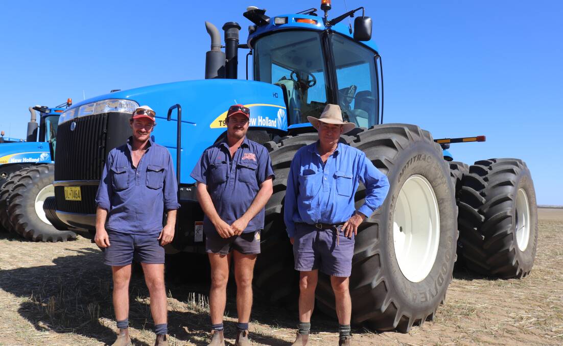 Still smiling, although they paid about $40,000 more than they expected to, Charlie (left), Ben and father Simon Forrester, Ballee Pty Ltd, Mogumber, paid top price at the clearing sale of $290,000 for this 2009 New Holland T9060 402kW (540hp) 4WD tractor on dual wheels with only 2022 engine hours and Trimble FM1000 GPS. An identical tractor, but with 3755 engine hours, was sold to DE & MR Greenham, Koorda, for $262,000.
