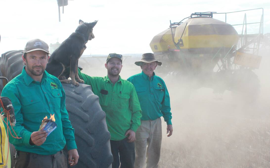  The dust was flying as Wagin farmers Ben (left) and Greg Ball (right) and their farm worker Jack Stallard put in the last third of their cropping program dry. Ben reckons the way the season is panning out they could burn a bit of money this year and he set fire to some Monopoly money to prove it!