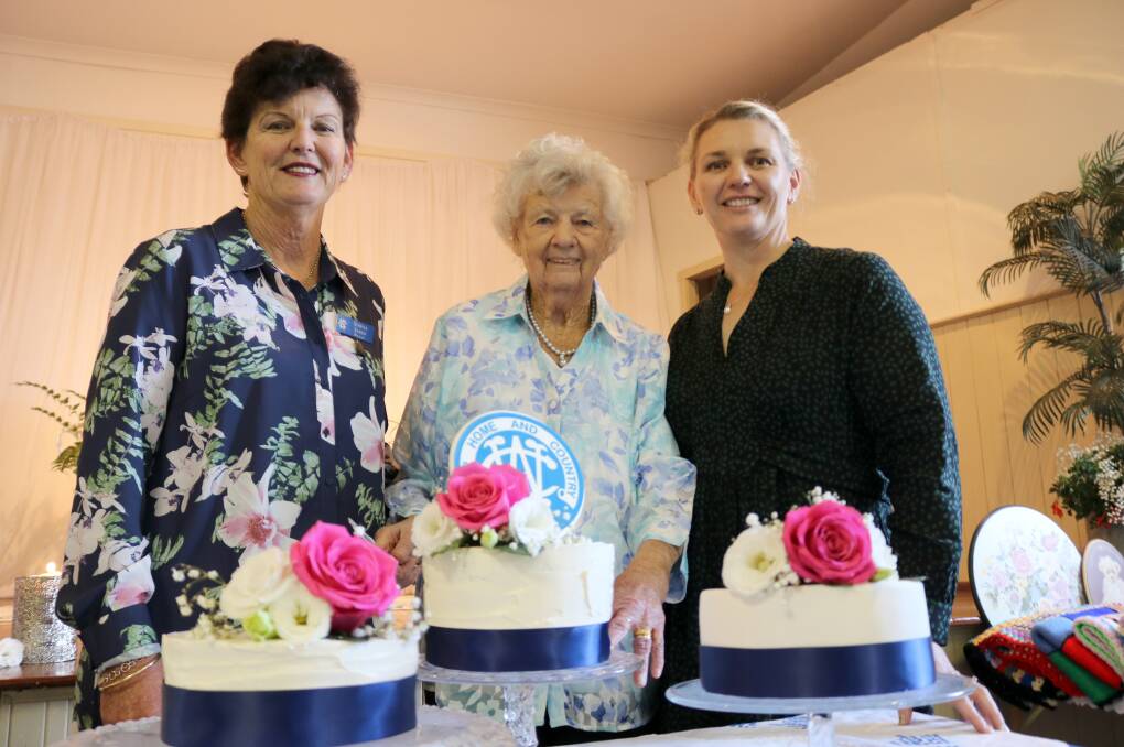 Natalie Syred (centre) had the honour of cutting the Bolgart CWA 95th anniversary cakes earlier this month. She is flanked by daughter-in-law Serena and granddaughter-in-law Annette who made the cakes.