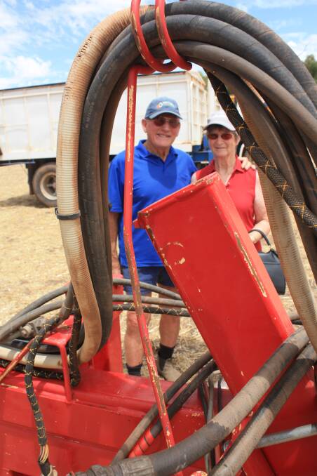  Wyalkatchem farmers Jim (left) and Jeanette McNee were "eyeing a bin" but passed on the Matrik 12 tonne pig trailer behind them which sold for $5000.