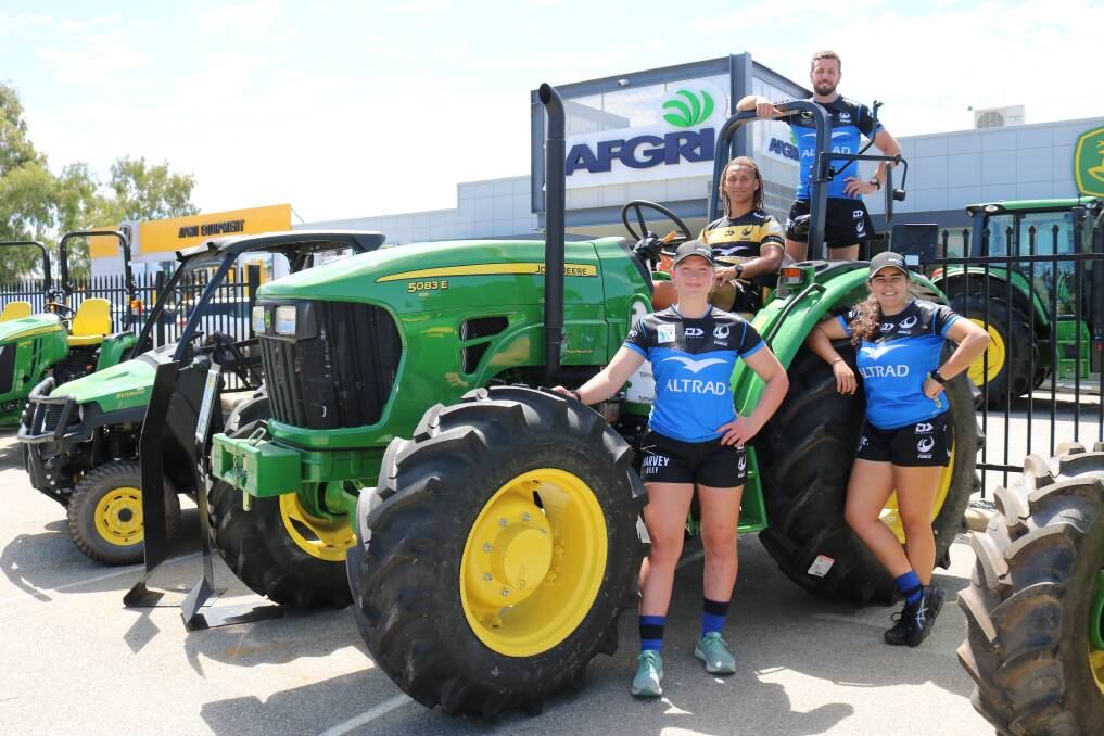Western Force players, womens team prop Chelsea Wulff (left), scrum halfs Issak Fines-Leleiwasa and Ian Prior and womens team hooker Sofia Bekir Fuente found plenty of machinery to look over at the AFGRI Equipment head office.