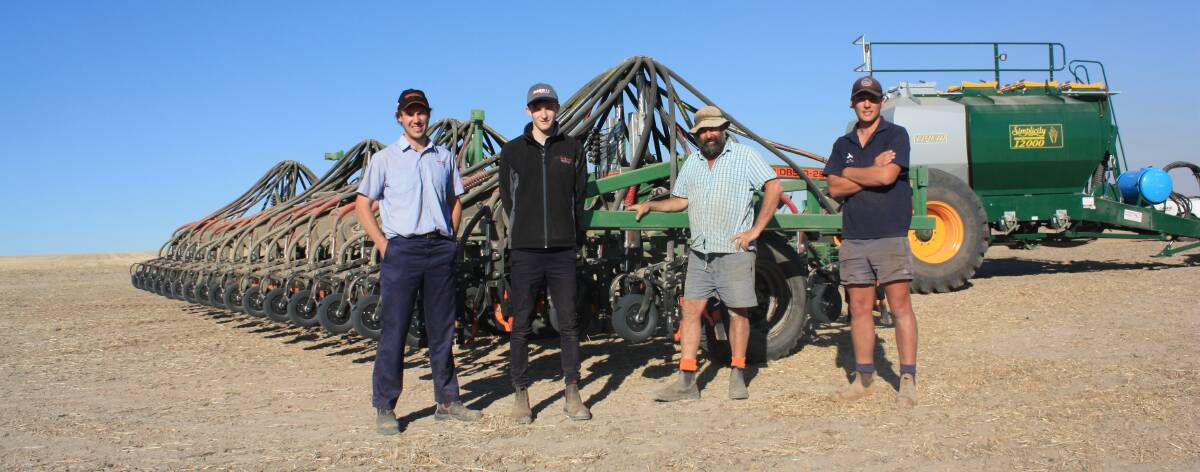 Boekeman Machinery Wongan Hills salesmen Ben Boekeman (left) and Ewan McLintock, Nathan Davey, Konnongorring and tractor driver Kane Corsini check out Mr Davey's new DBS precision seeder, replacing his original DBS which he had for 20 years. 
