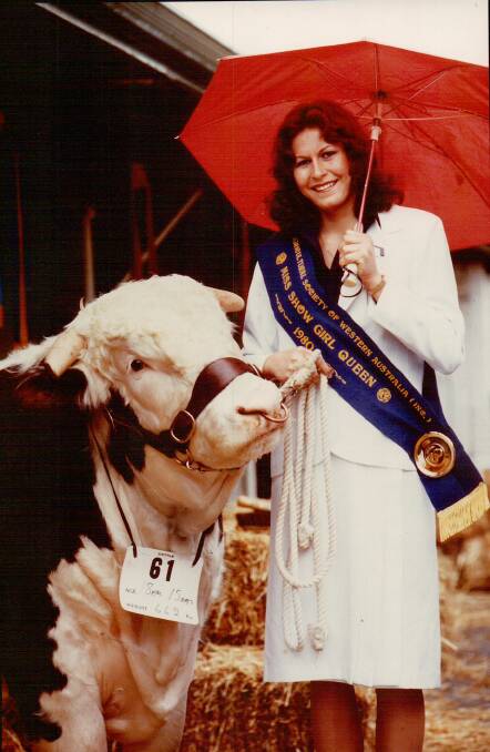 Leanne Jensz holds one of the Cabassi familys Hereford bulls in 1980 after winning the Miss Showgirl State final at the Perth Royal Show in 1980. 