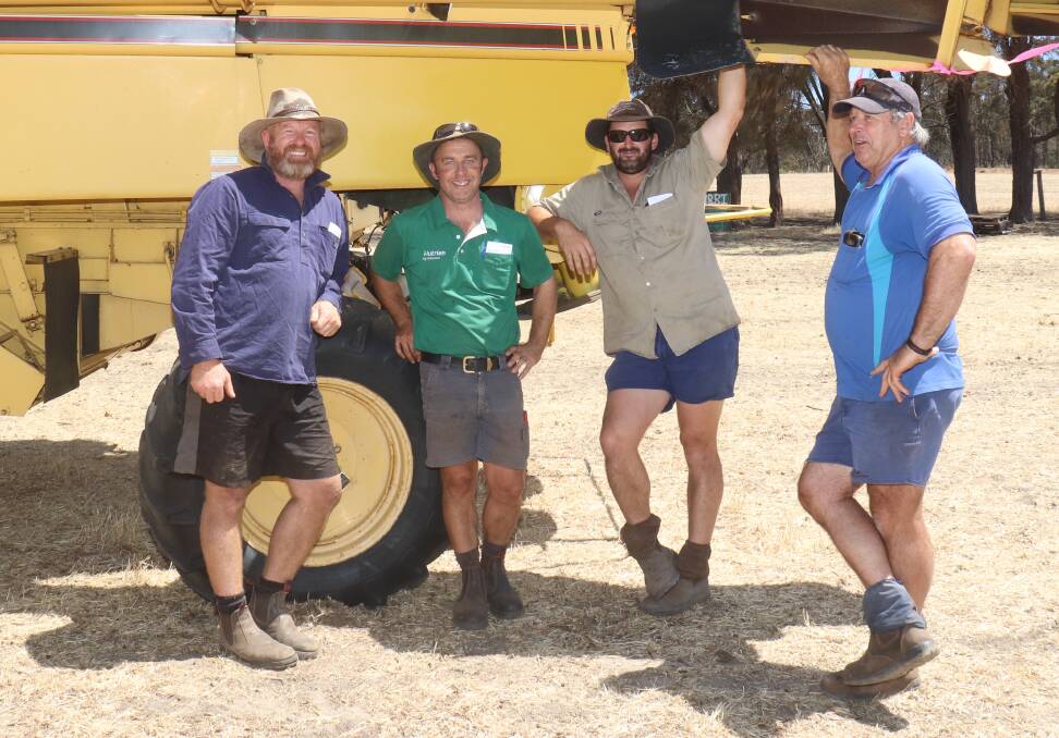 Wayne Girando (left), Boyup Brook, Mat Chambers, Darkan, Tristan Mead, Dinninup and Ron Bingam, Boyup Brook had a look at this New Holland header, which ended up selling for $9250.