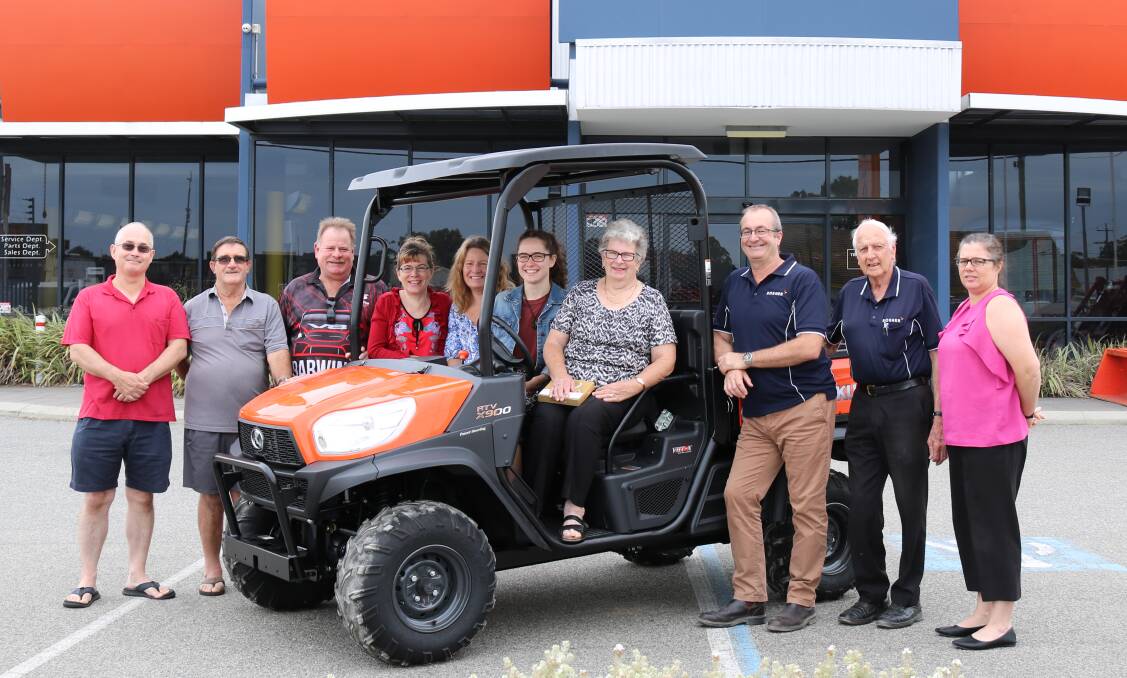  At the Rosher showroom to watch Jennifer Colum collect her prize of a Kubota RTV-X900G-A-AU utility vehicle were her sons-in-law Ray Howell (left), Mandurah and Paul Kelly, Marangaroo, son Michael Colum, Pinjarra, daughters Liza Howell and Jo-Anne Kelly, granddaughter Cassie Howell, Jennifer Colum, Rosher principals Ted and Cameron Rosher and Farm Weekly livestock manager Jodie Rintoul.