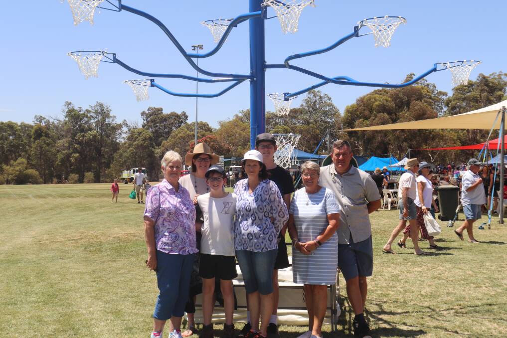 A special blue netball tree was made in memory of 20-year-old Tamia Schinzig, by her twin brother Adam. The tree is called TAMs Tree Talk About Mental Health and was displayed all day at the Darkan Sheepfest. The family included Fay Smith (left), Nerida Pickup, Trent Pickup, Flynn Pickup, Kylie Schinzig (Tamia's mother), Ann Wright and Michael Pickup.