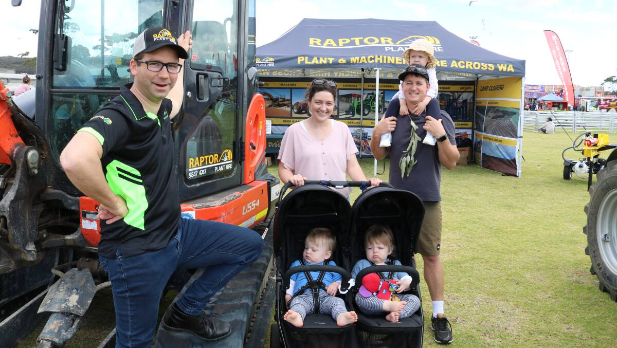 Twins Kai and Flynn Thompson spent their first birthday at the Albany Spring Fair with parents Sally and Adam and sister Ava, 2, where they looked through the Raptor Plant & Machinery Hire stand with director Steve Richardson (left).