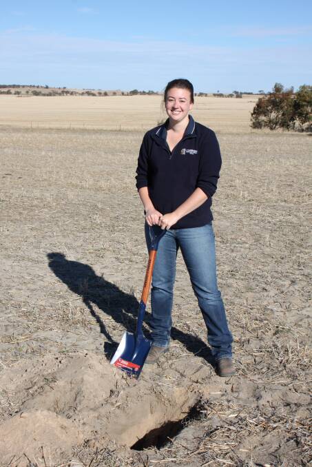 Corrigin Farm Improvement Group executive officer Veronika Crouch looks at the different soil types at depth.