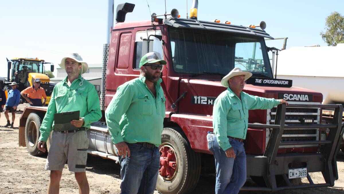  Auctioneer Chris Waddingham leans on the bullbar as he sells the Scania 112H prime mover for $14,000.