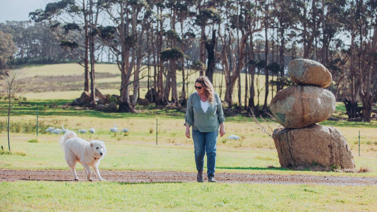 Ms Clark, owner of The Coastal Studio and her wonderful dog Mica on the farm where she lives with her partner Rob Martin. Photo by Katrina Hawley Photography.