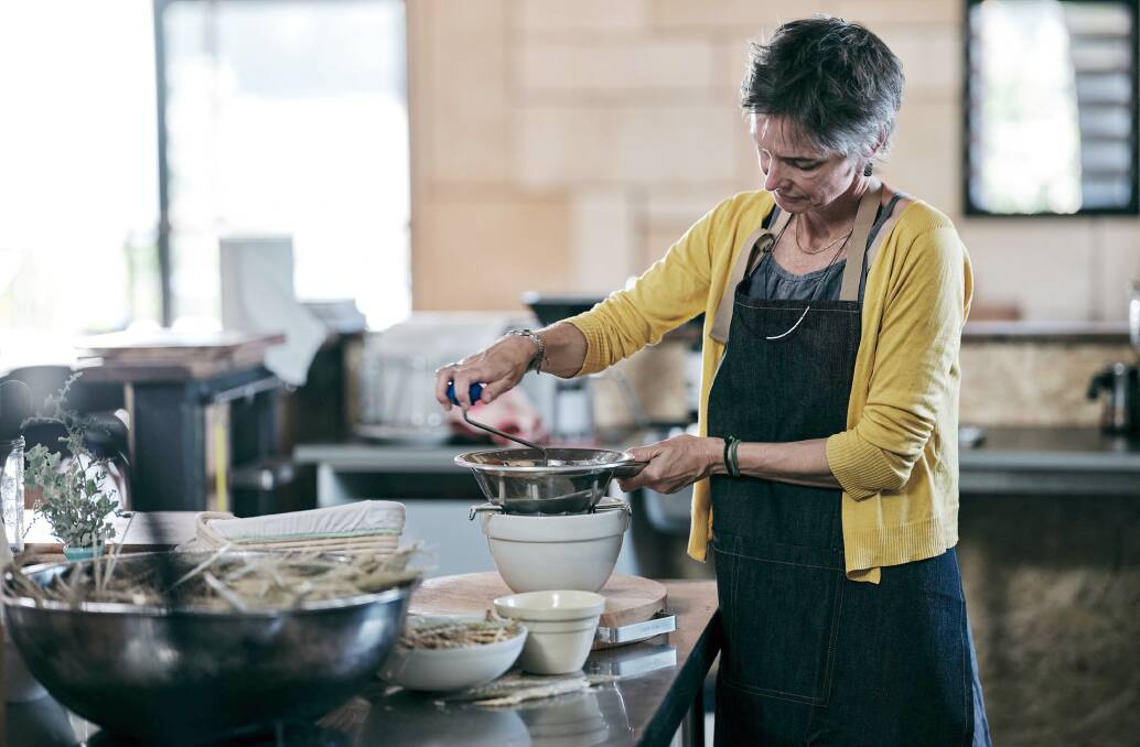 Cree Monaghan making passata in the One Table Farm teaching kitchen. Photo by Russell Ord.