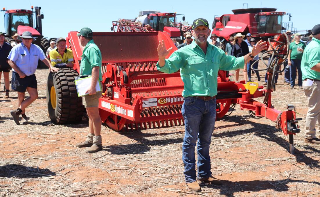 Nutrien Ag Solutions auctioneer Craig Walker, Geraldton, in action in front of the Highline rock picker which sold for $45,000 during the Yandanooka sale.