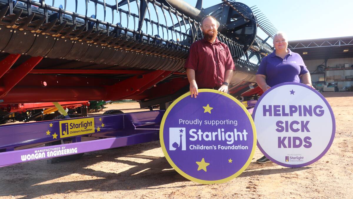 Boekeman Machinery Wongan Hills branch manager Dillan Elliott and Starlight Childrens Foundation representative Cath Petsos with the header comb trailer painted in the foundations signature purple to raise awareness of its activities helping children in hospital. Boekeman Machinery has donated $2500 from the sale of the comb trailer and header front on it, to the foundation.