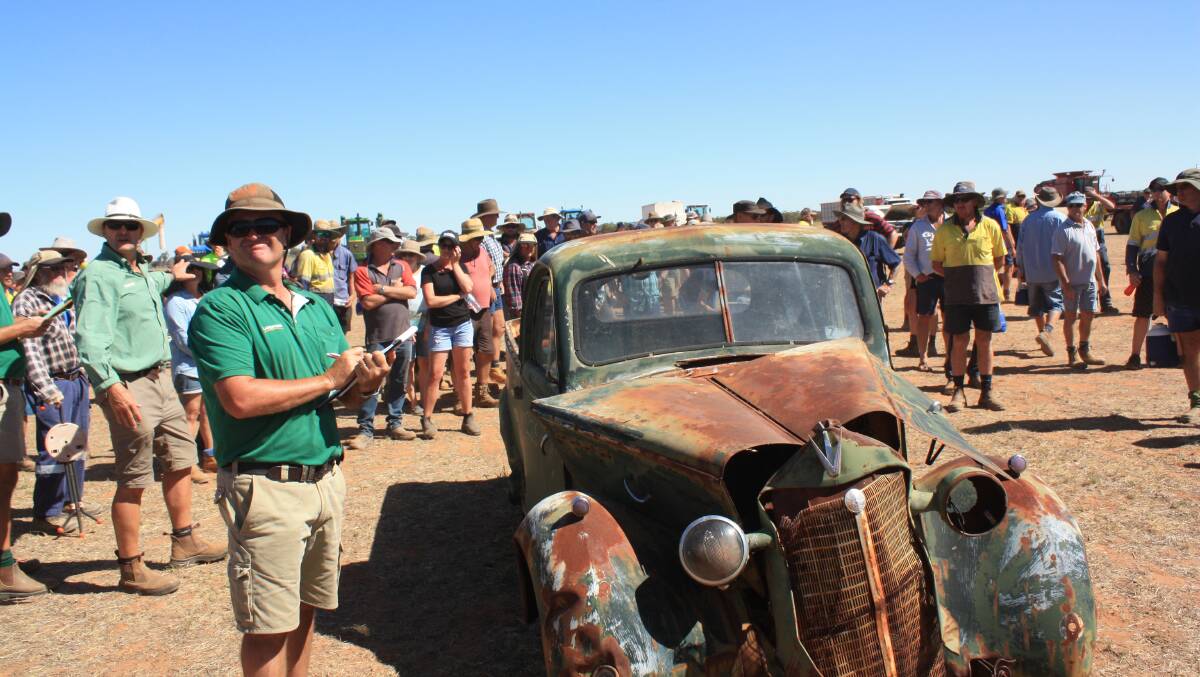 Landmark Beacon sale clerk Ashley Walker looks for bids for this old Bedford ute which was obviously eyed for a restoration job. It was sold to Russell Stratton, Nunile, for $350.
