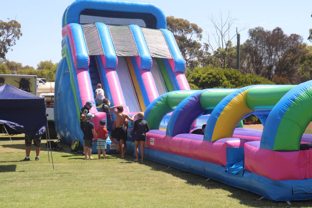 With the hot weather it was a good day for bouncy castles and water slides.