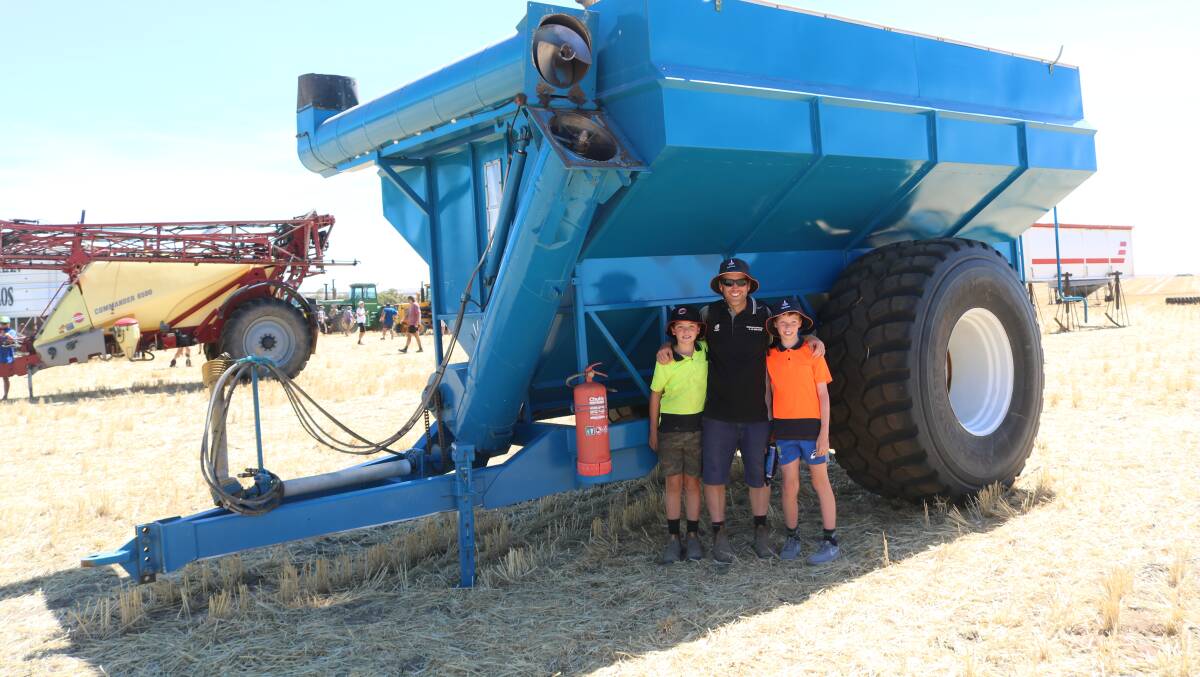 Seeking the shade and looking over this chaser bin was Ciaran Murray-Miguel (left), 9, Beacon, with dad Danny Miguel and brother Patrick Murray-Miguel,11.