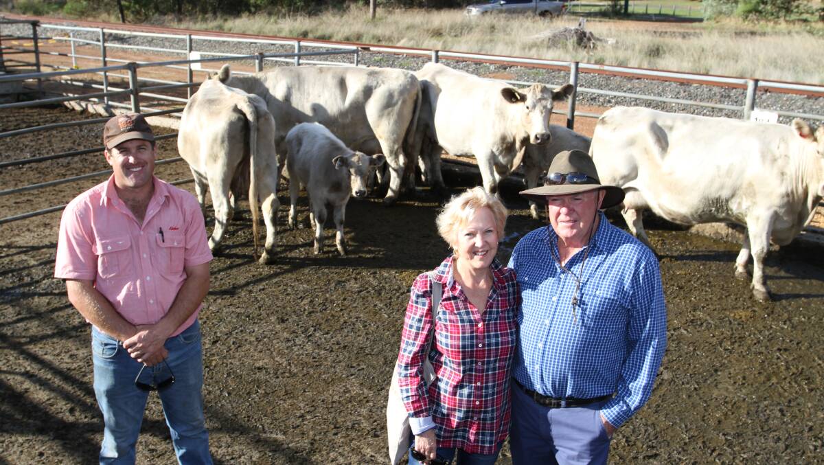 Craig Martin (left), Elders Brunswick and vendors Julie and Barry Warwick, Baypoint Holdings Pty Ltd, Benger, who dispersed the last of their Murray Grey breeding herd at the sale with their fifth and sixth calving Murray Grey cow and calf units (not rejoined) selling to $2300.