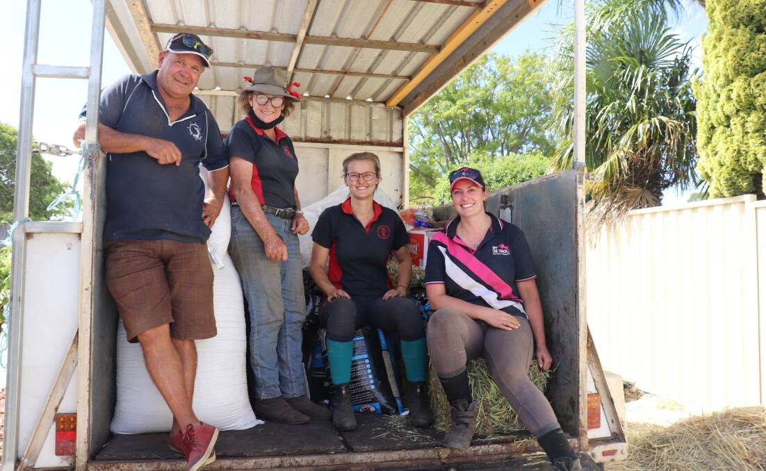Ascot stables owner Ian Glading with M'liss Henry, Monika Magalengo and Hannah Jones from Claremont Therapeutic Riding Centre who were collecting feed for 10 horses being looked after at the centre.