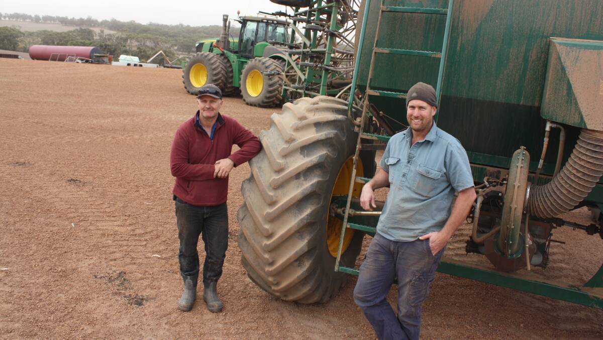 Annadale Farm, Koojan, employees Mike Bezuidenhout (left) and Mike Smith finished a 5900 hectare program days before the start of last week's rain activity last Friday. "They started the week before Easter and for the past four weeks they've been working round-the-clock getting it in," farm owner Jaden Cocking said. "We ended up with 46 millimetres by Monday morning and I'm hoping for another 10-15mm by the end of Tuesday. It has given us plenty of confidence for above average crops and our next job is getting the nitrogen out." The seeding rig the two Mikes are standing next to comprises a new 4WD John Deere 9570R, a 18.2 metre DBS precision seeder and a Simplicity 12,000 air seeder. "There's 841 hours on the clock of the 9R after that effort," Mr Smith said.