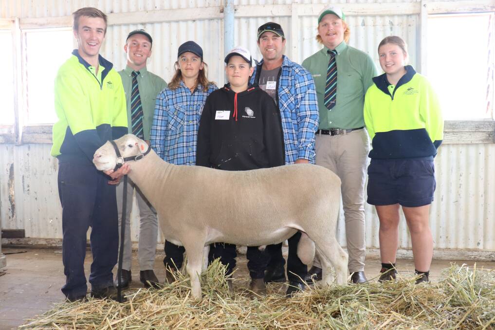 WA College of Agriculture (WACOA), Cunderdin student Brady Garlick (left) holding the top-priced ram from the college's Poll Dorset stud, Landmark auctioneer and Corrigin representative James Culleton with buyers Kane, Tyson and Glen O'Driscoll, Grass Valley, Landmark livestock trainee Jake Finlayson, Kellerberrin and WACOA Cunderdin student Courtney Hall.