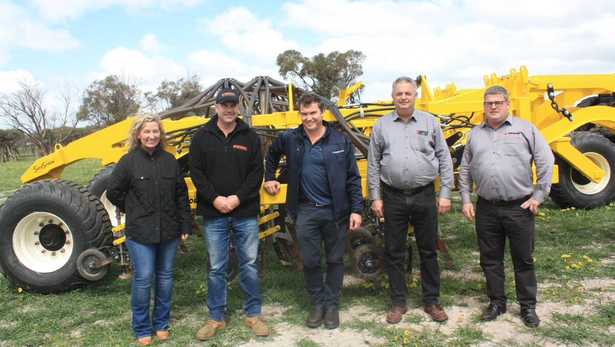 Ground Hog principals Nadia and Jack Auldist, O'Connor, McIntosh & Son director Stuart McIntosh, Perth and Duraquip directors Garry and Rodney Richardson, Gnowangerup, next to the Seed Storm seeding bar built by Duraquip, with Ground Hog seeding modules.