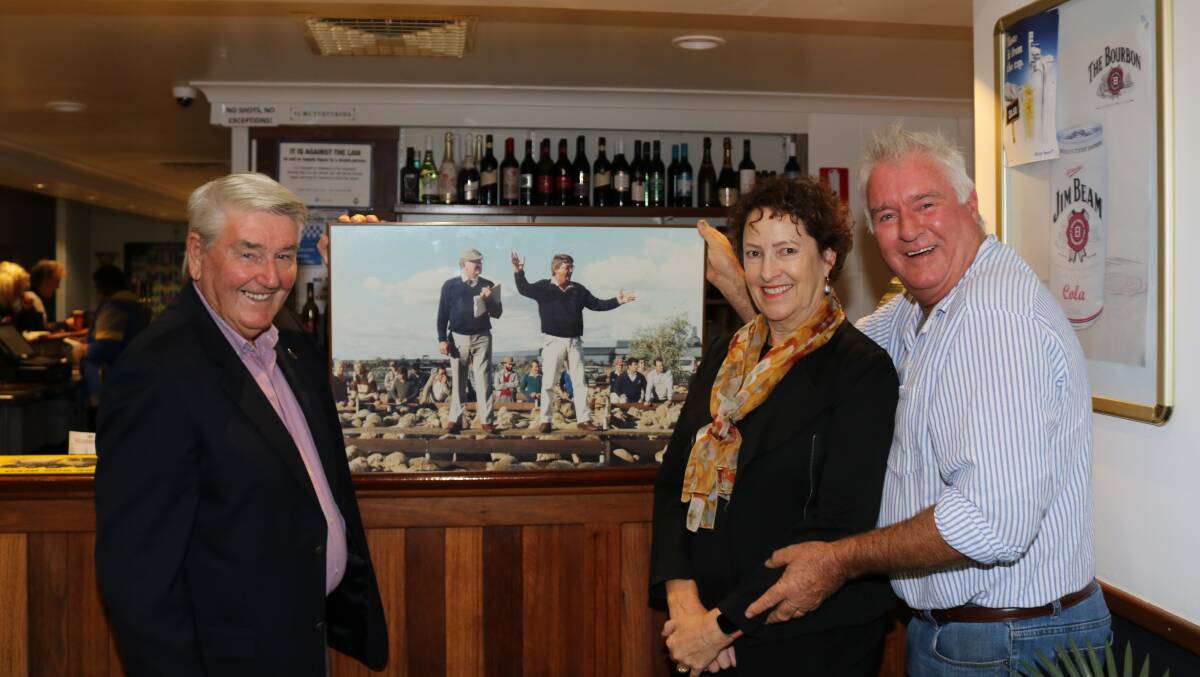 Adrian Gamble with Michelle and Trevor Ryan, PJ & JA Ryan and Sons, Dremdarkin Farms, Yorkrakine and the photo of their line of 404 record top-priced Merino wether hoggets which sold for $80.20 to Sandalwood Farms manager Tony Henry, Borden, at Kellerberrin on Monday May 16, 1988. On the rail with Mr Gamble as he sold the line was Elders manager Neil Williamson.