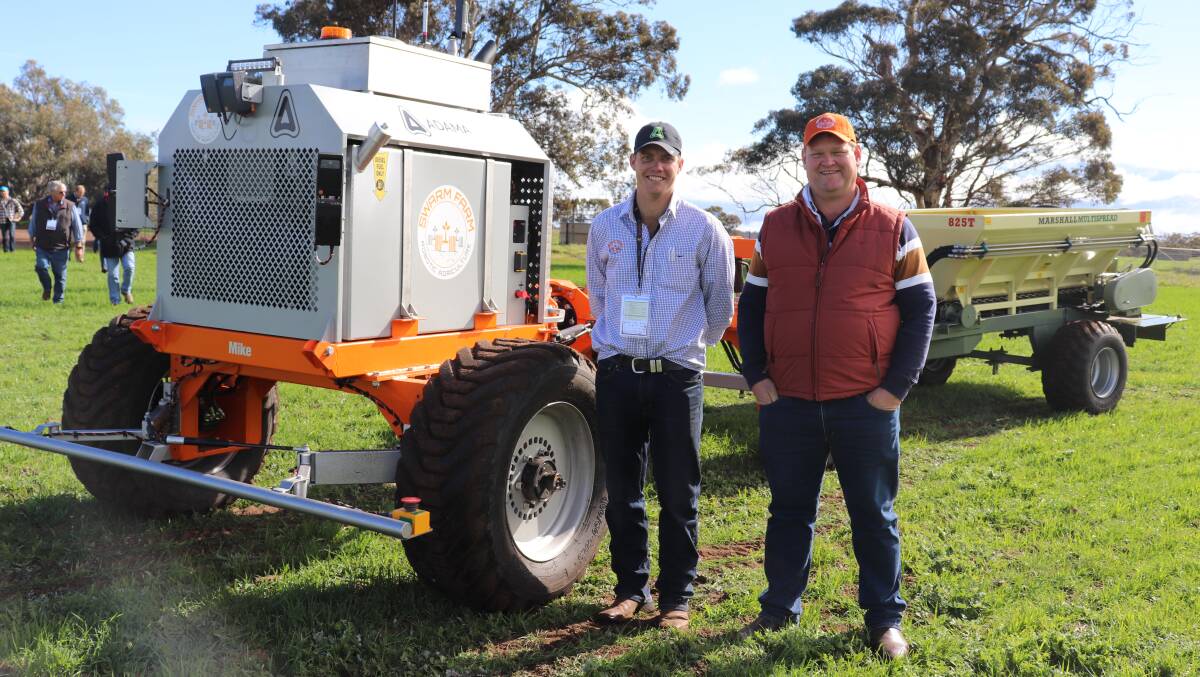 Swarm Farm field engineer Tom Holcombe (left) with founder and chief executive officer Andrew Bate, Emerald, Queensland, standing beside their display at the Southern Dirt TECHSPO 2019 at Katanning last week. The autonomous Swarm Farm machine was pulling a Marshall Spreader but it could also pull other systems such as sprayers, depending on the need.