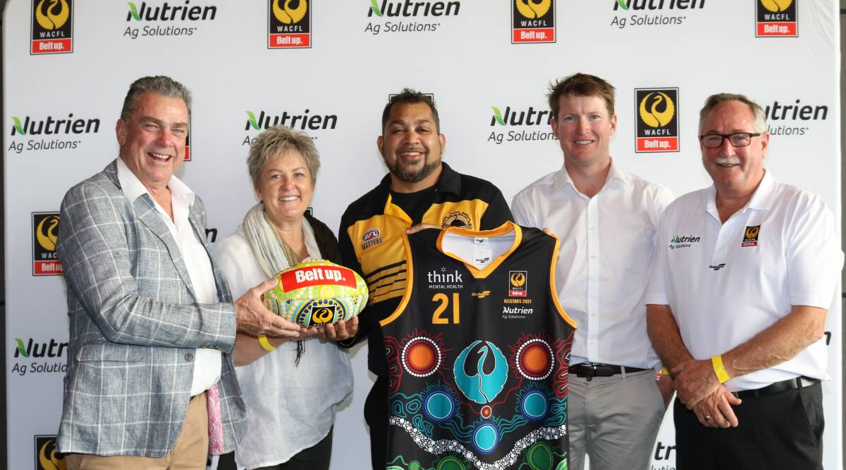 With the two items auctioned on the day were WAFCL president John (left) and Debbie Shadbolt, Mukinbudin, who bid to $320 for the painted football, artist Kevin Bynder who designed the 2021 WACFL All Stars jumper, buyer of the jumper at $525, David Mitchell, Morawa Football Club treasurer and auctioneer and Nutrien Ag Solutions key account manager, Steve Wright.