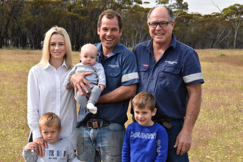 Hyden farmers and part buyers of Glen Elgin Farm, Hyden, Jenna and Elliott Mouritz (centre), with his father Vern and their children Emmett, 3, Vance, 4 months and Gibson, 5. "We feel that this photo represents our business now and into the future," Elliott said. "We purchased the land with the future in mind." Photos by AWN Property (WA).