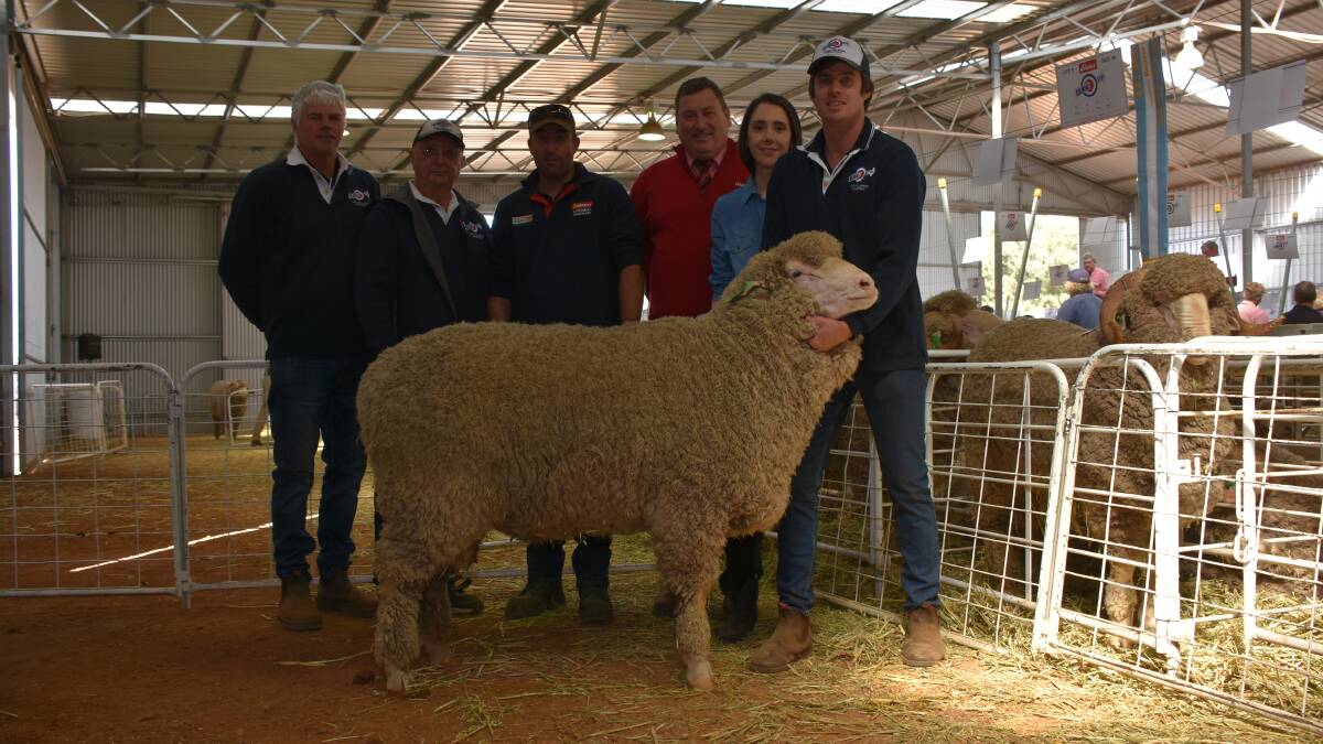 With the $6000 top-priced Poll Merino ram at the Kolindale on-property ram sale at Dudinin on Monday were Kolindale co-principal Mathew Ledwith (left), former stud principal Colin Lewis, buyer Dave Davies, Rockdale Farming Co livestock manager, Muntadgin, Elders stud stock manager Tim Spicer and Kolindale co-principal Daniela Varone and Luke Ledwith.