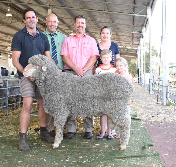 Prices hit a high of $6100 for this Poll Merino ram from the Navanvale stud, Williams, at the Williams Breeders' Ram Sale last week when it was knocked down to the Schulz family, WB & BM Schulz, Williams. With the ram were Navanvale co-principal Mitchell Hogg (left), Landmark Williams agent Ben Kealy, Elders auctioneer Nathan King and Natalie Schulz and children Manton and Zinnea.