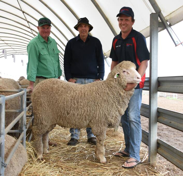 Nutrien Livestock Brookton/Pingelly agent Chris Turton (left), buyer Bevan Waters, Nalyaring & Co, Brookton and Manunda's Scott Button with one of the sale $4500 equal second top price rams which was purchased by Mr Waters.