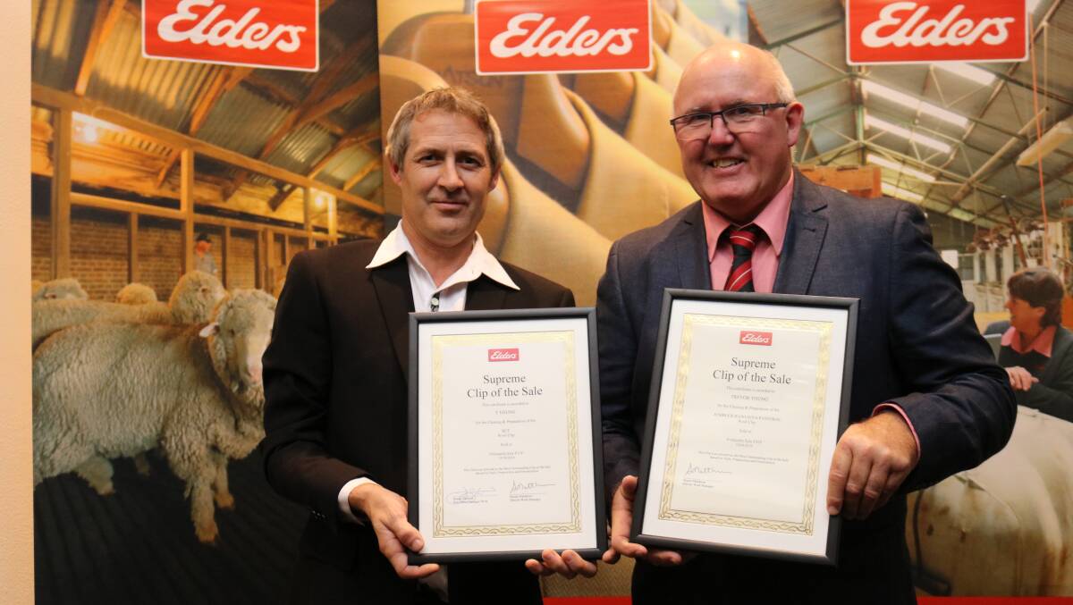 Classer Trevor Young (left), Esperance, was congratulated by Elders district wool manager Stuart Matthews on classing the Teasdale family's clip at Gibson and the Rawlinna station clip, which won the Supreme Clip of the Sale awards for sales F11 and F41 respectively.