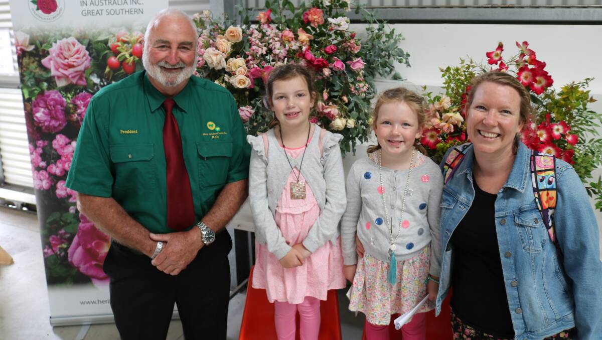 Albany Agricultural Society president Rob Wright with sisters Gabby, 7 and Olivia Hill, 5 and their mother Belinda Bolger, Albany, in the colourful heritage roses display.
