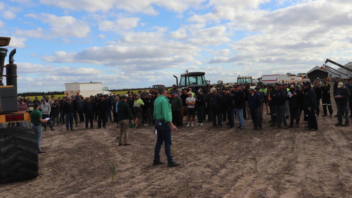 The crowd at the West River on farm clearing sale last week as it followed the bidding on the machinery for sale.